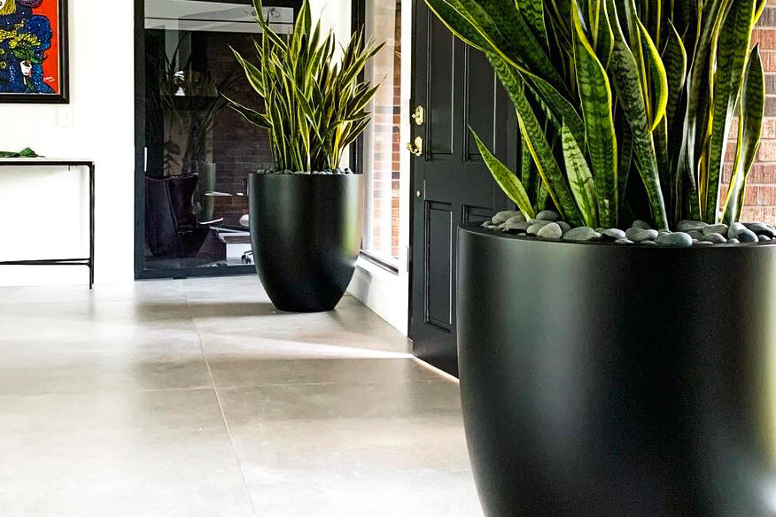 round planters in hallway